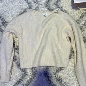 This H&M sweater is a size small and cotton.